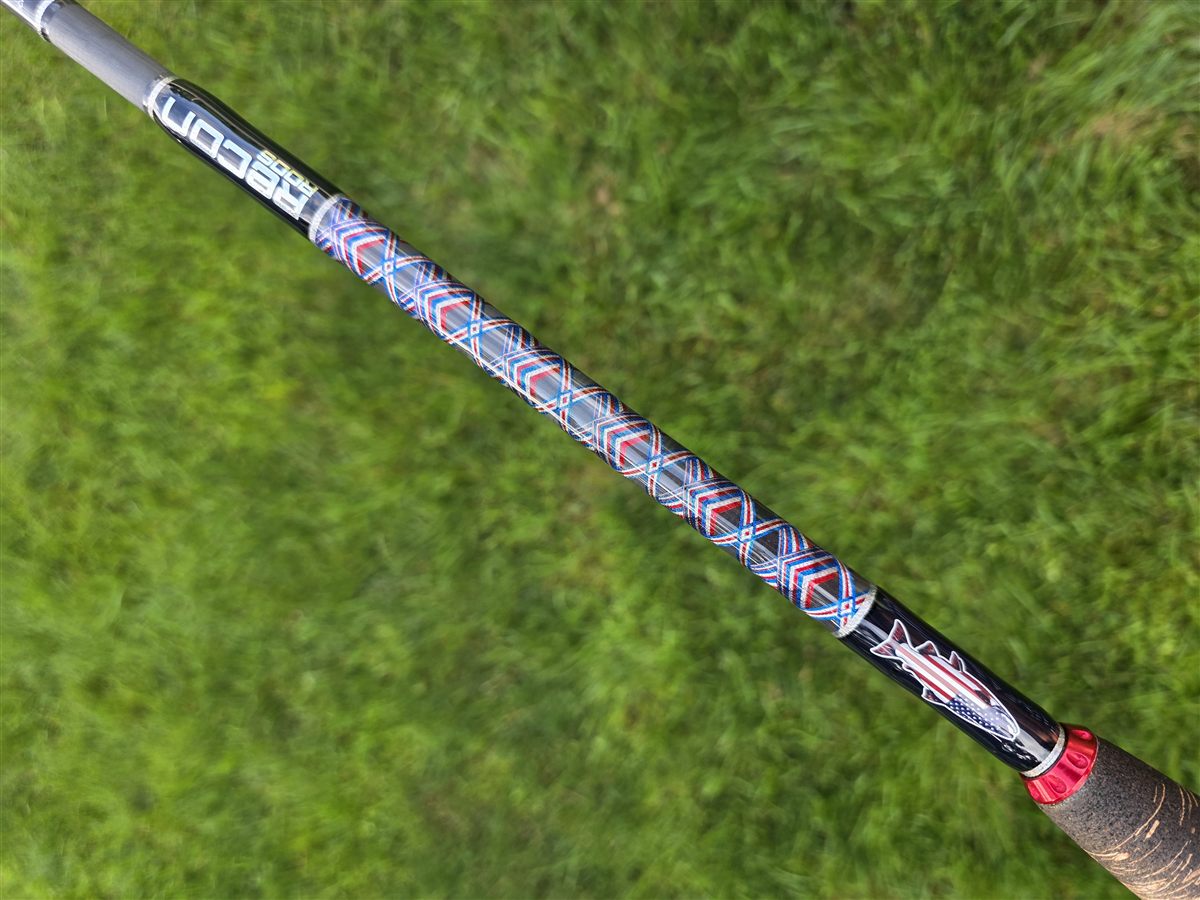 A Recon Rods custom fishing rod with red, white, and blue decorative threadwork
